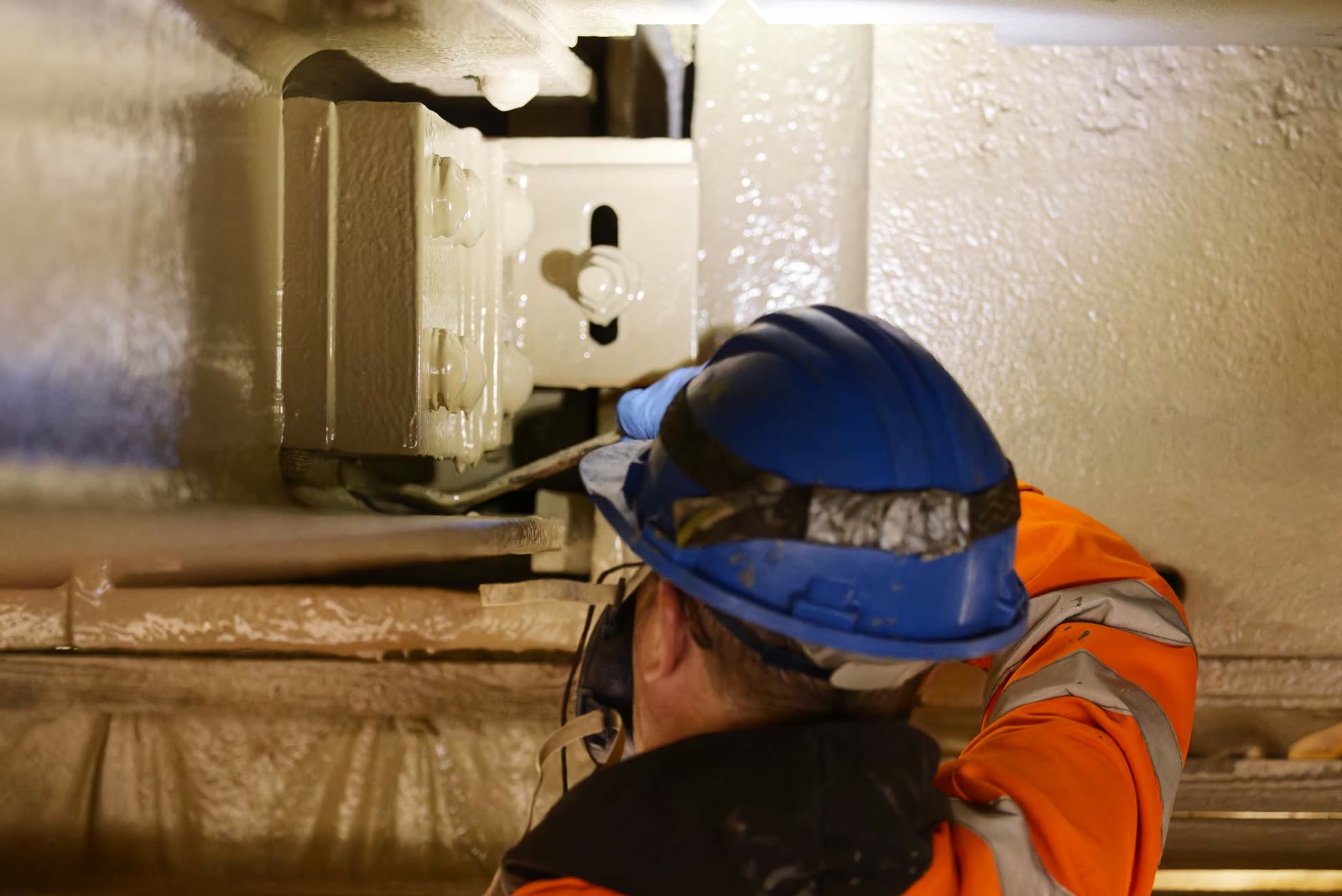 Engineer carrying out an inspection of the bridge structure at deck level